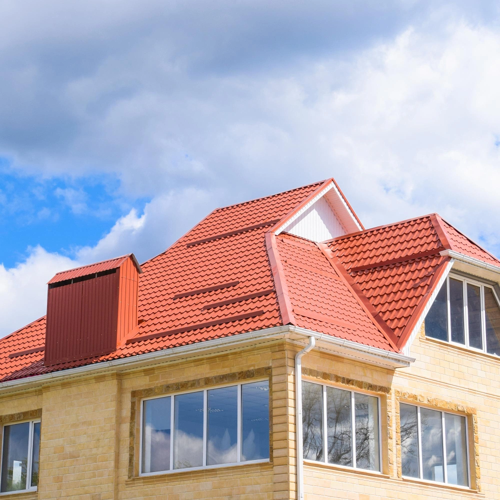 Roofing Pro LA completed red tile roof installation on residential brick home in Los Angeles