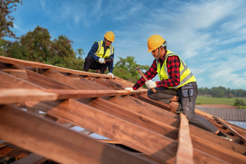 Roofing Pro LA crew installing new wooden roof framing and structural supports on a Los Angeles residential project
