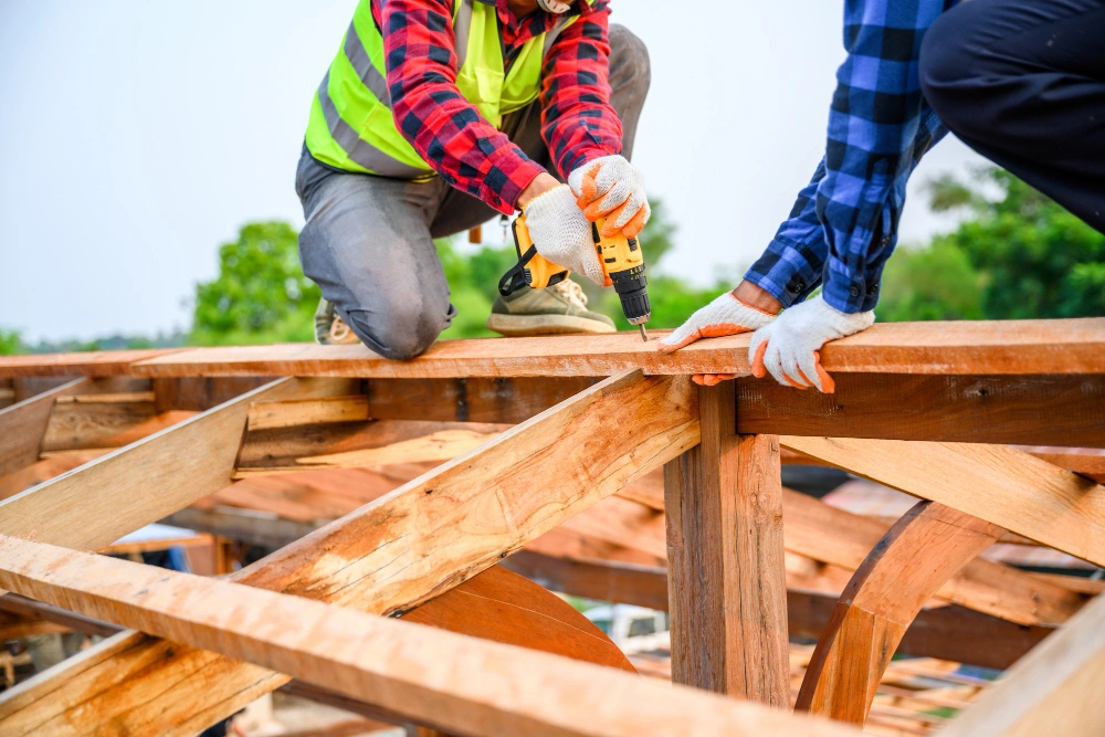 Skilled roofing technician securing roof panels during installation by Roofing Pro LA